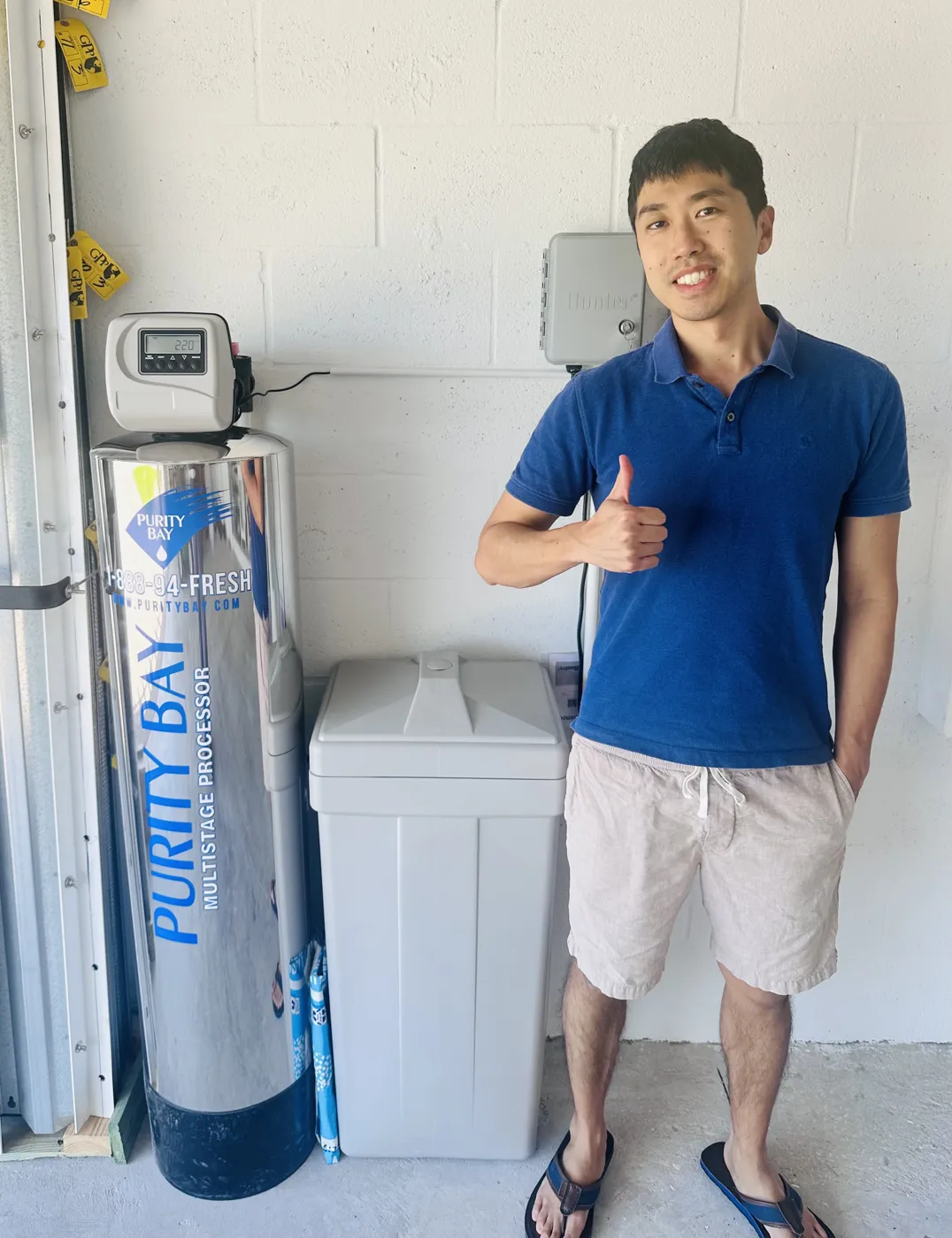 Odessa homeowner beside his Purity Bay 10X Elite whole home water system