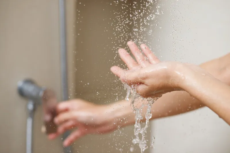 Clean water flowing from shower head